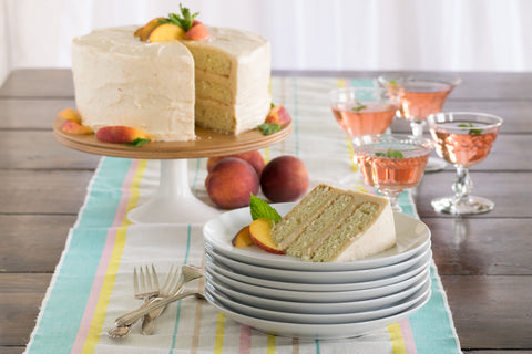 Old-fashioned peach cake on a platter on a table