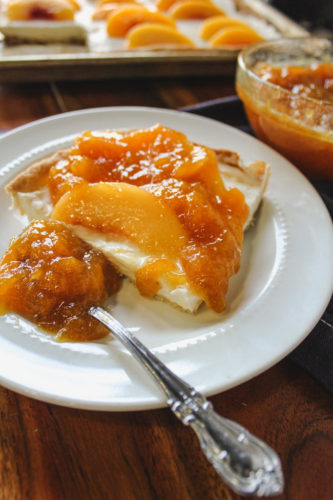 The peach preserve slab pie served on a white plate