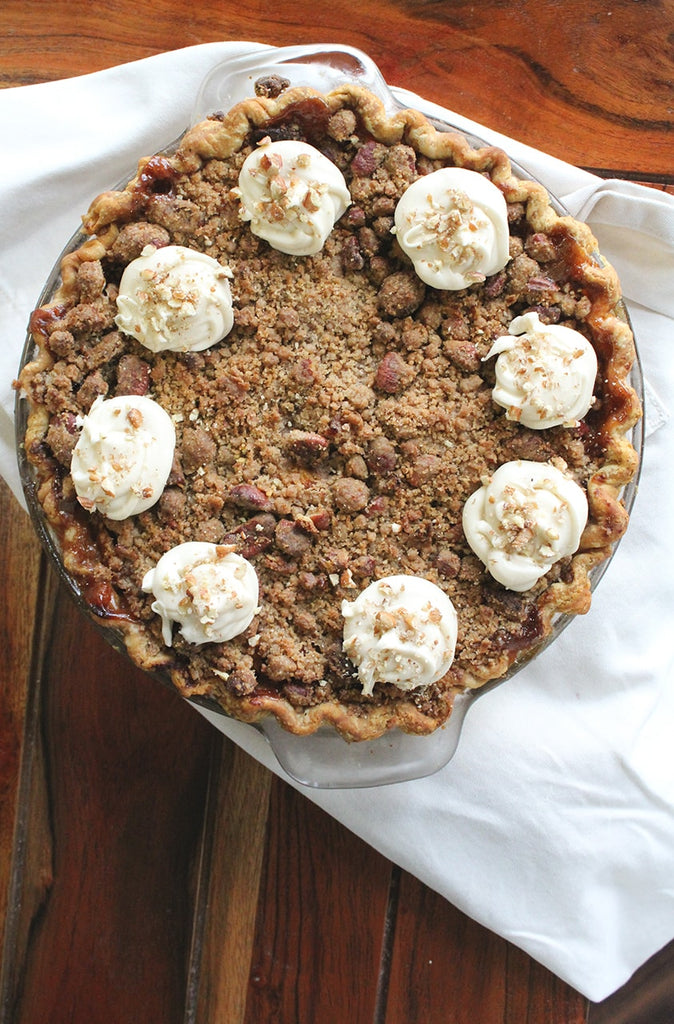 The top of a peachy hummingbird pie with whipped cream