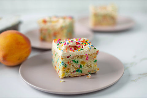 Slices of sprinkle cake served on grey plates