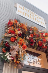 Beautiful fall floral arrangement for women's clothing boutique.