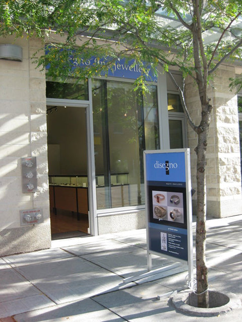 Front door of boutique and sidewalk.