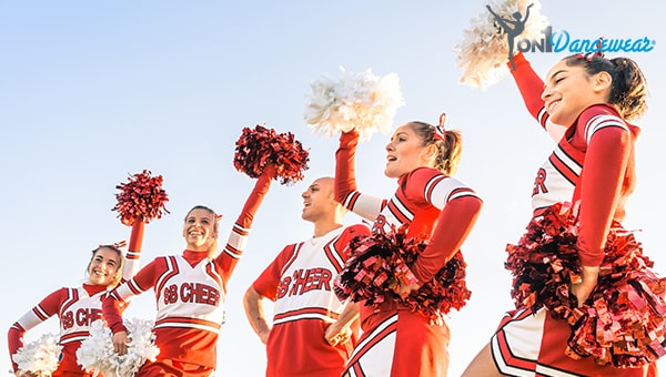 The Evolution of the Cheerleading Uniform, From Bulky Sweaters to