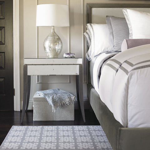 a mirrored side table always completes an elegant bedroom