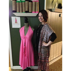 Orchid Nest owner Lorie McCoy with a Pretty Pushers display
