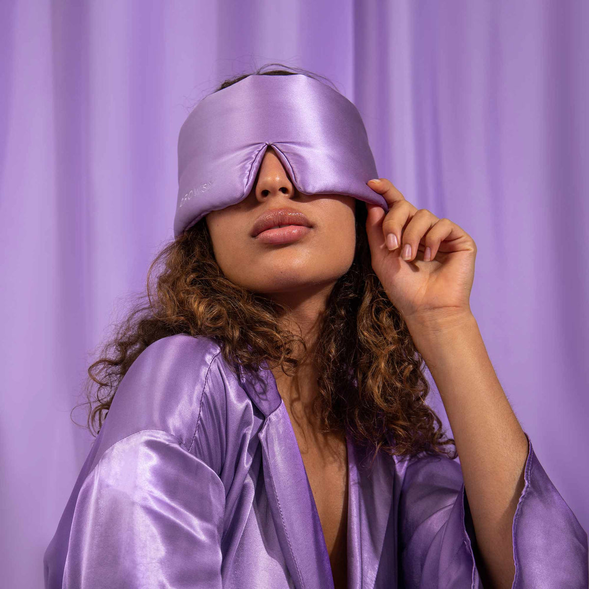 Model with Drowsy Silk sleep mask covering eyes