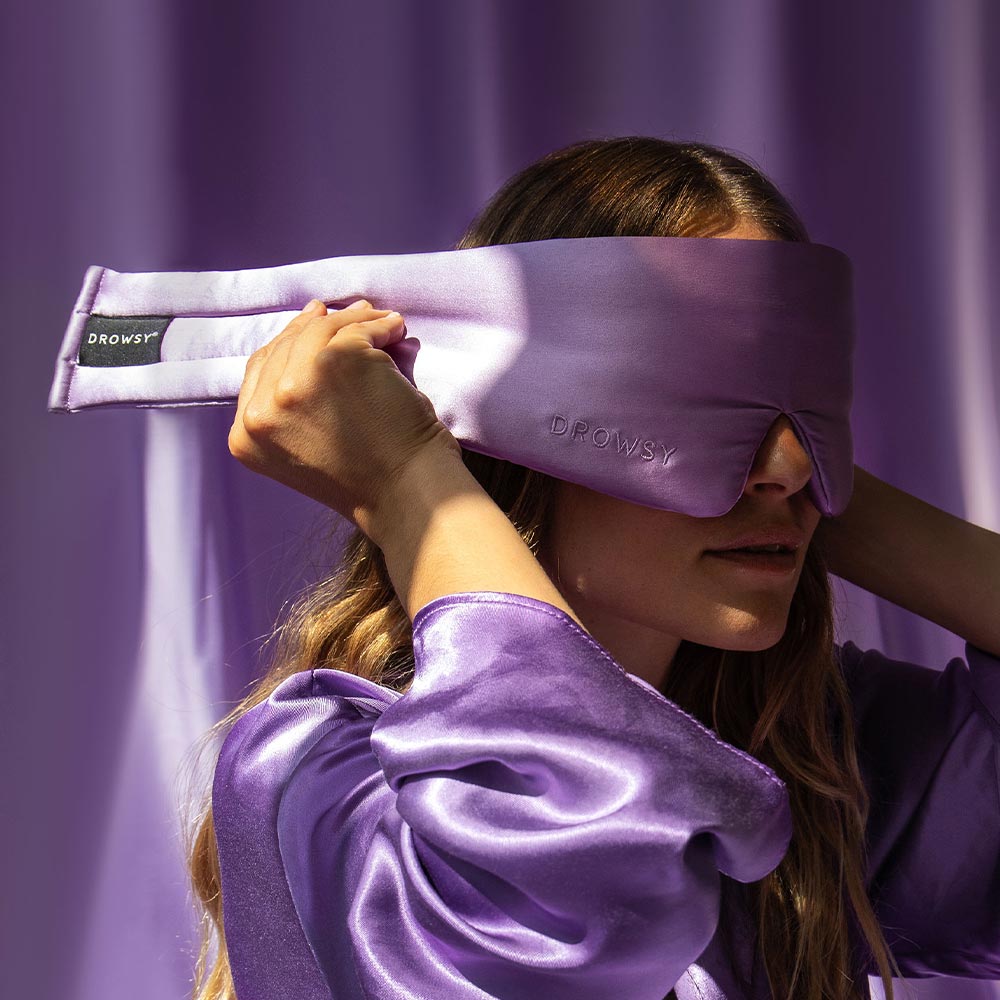 Model demonstrating the wide strapless design of Drowsy Silk Sleep Mask