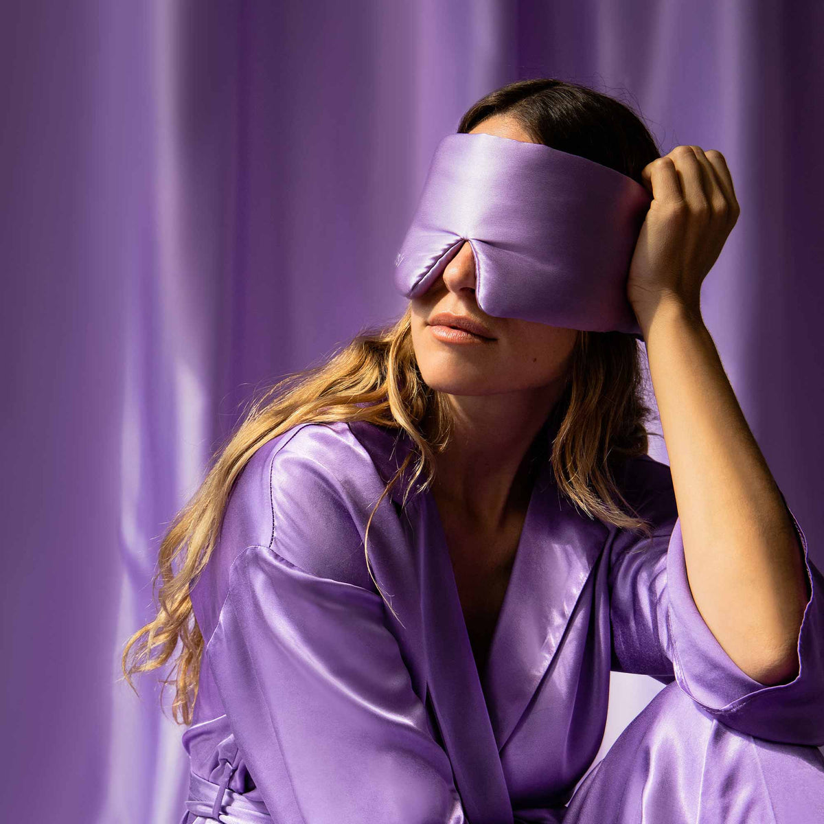 Model blocking out light using Drowsy Sleep Co Silk Mask