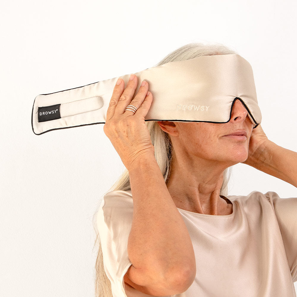Model demonstrating the wide strapless design of Drowsy Silk Sleep Mask