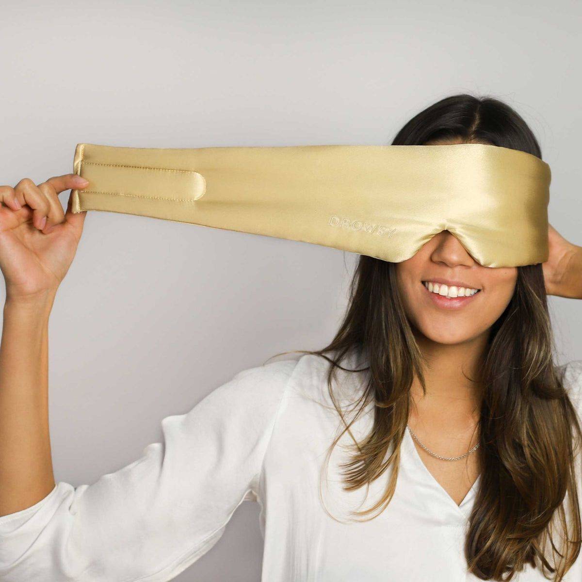 Model demonstrating the wide strapless design of Drowsy Silk Sleep Mask