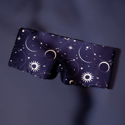 Drowsy starry patterned silk sleep mask on a blue background