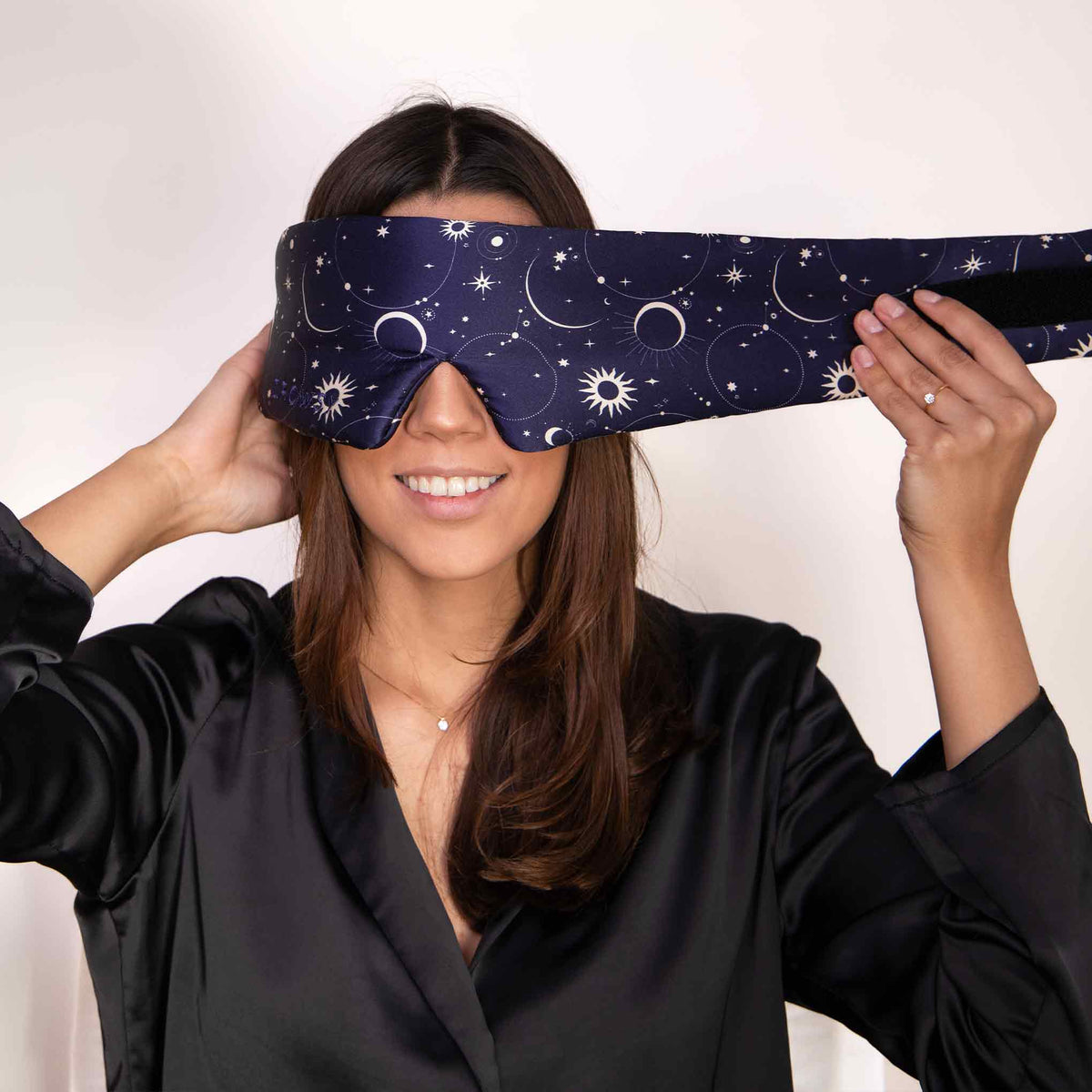 Model demonstrating the wide strapless design of Drowsy Silk Sleep Mask