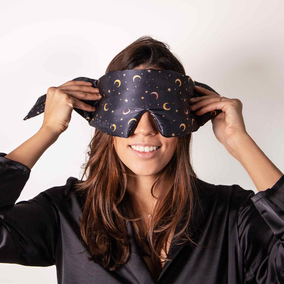 Model demonstrating the wide strapless design of Drowsy Silk Sleep Mask