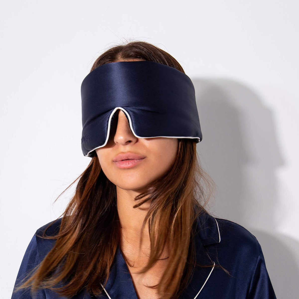 Model blocking out light using Drowsy Sleep Co Silk Mask