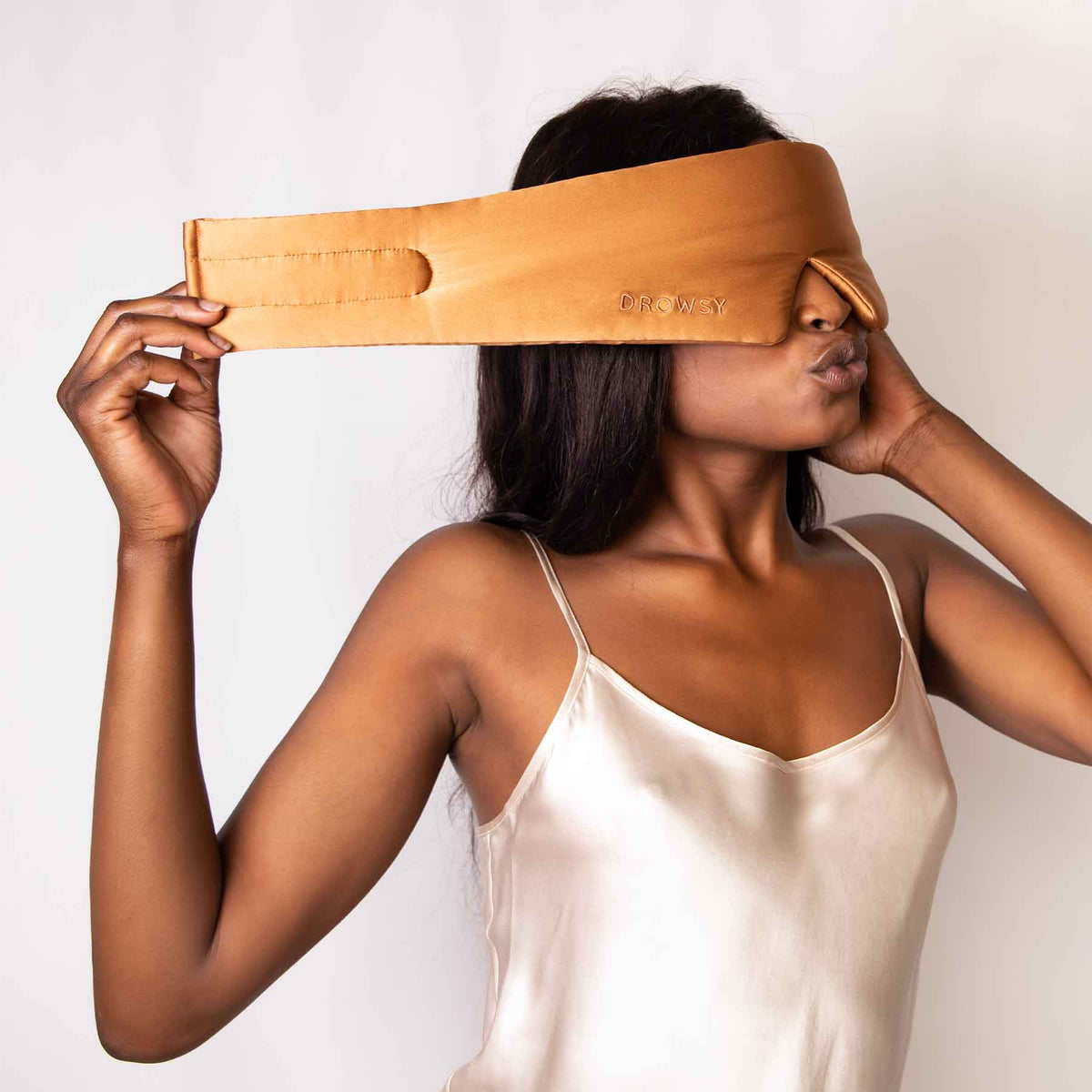 Model demonstrating the wide strapless design of Drowsy Silk Sleep Mask