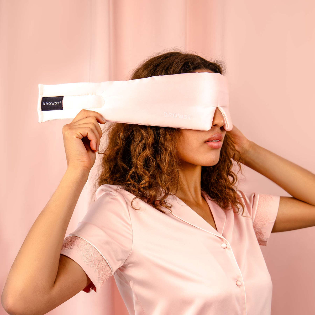 Model demonstrating the wide strapless design of Drowsy Silk Sleep Mask