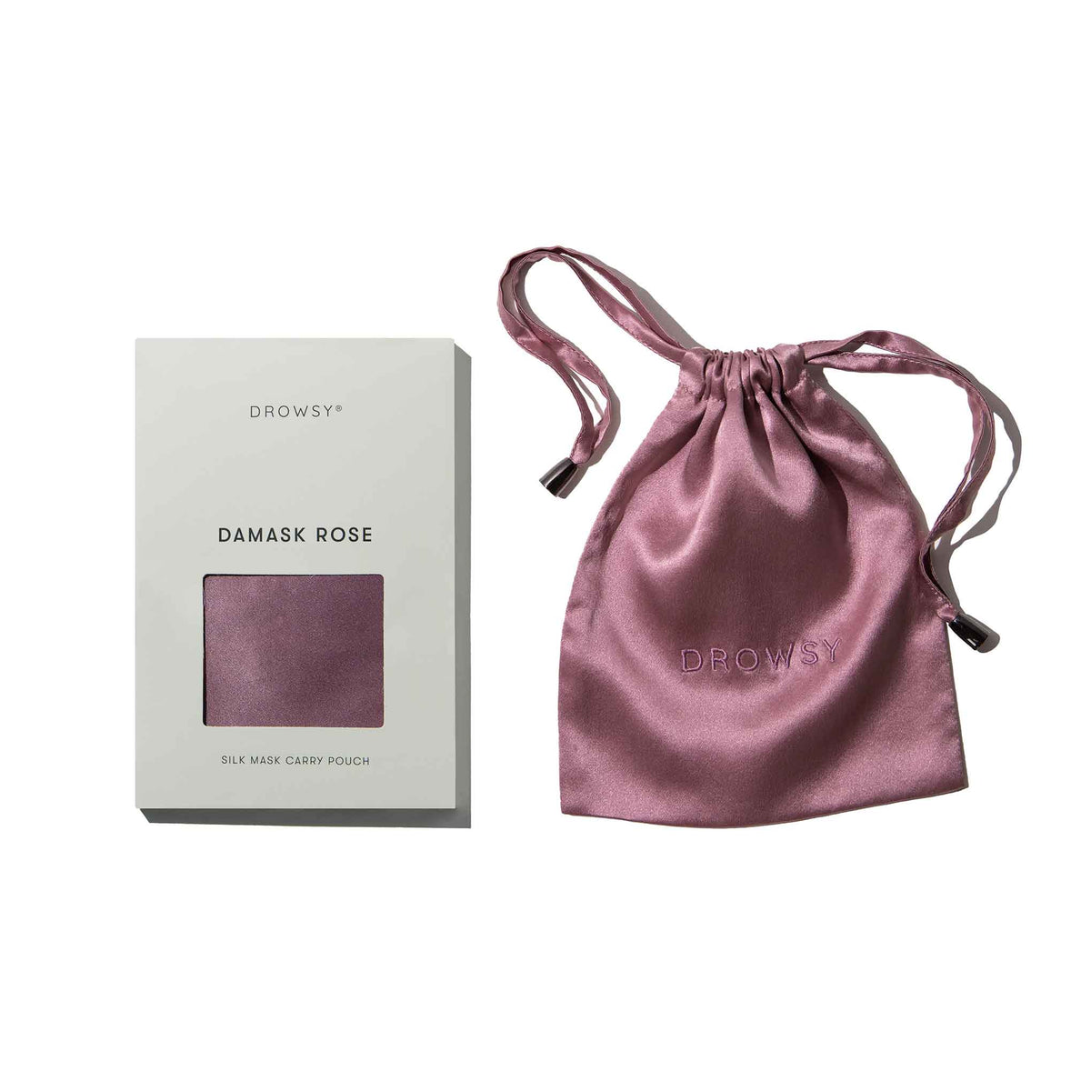 Pink silk bag with box on white background