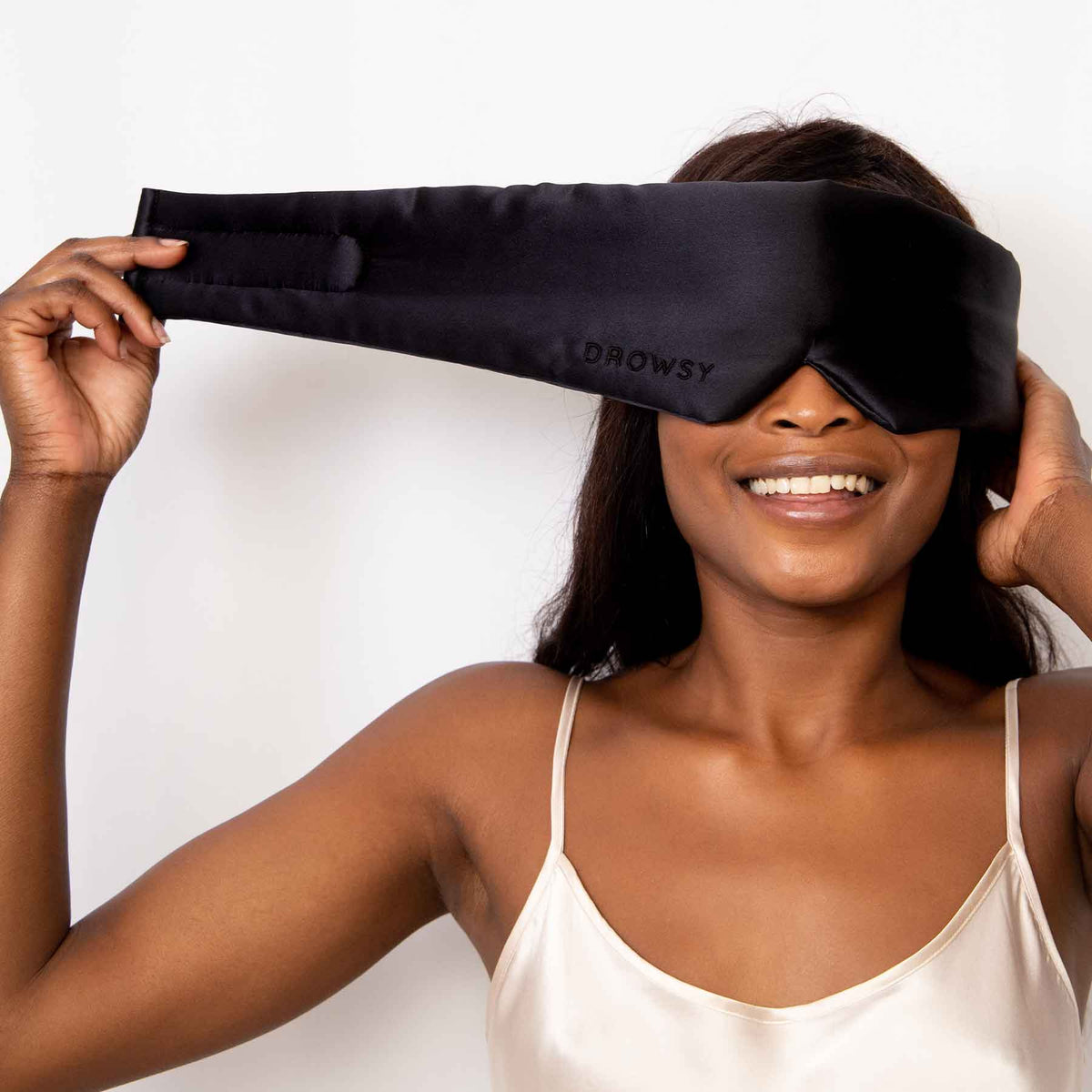 Model demonstrating the wide strapless design of Drowsy Silk Sleep Mask