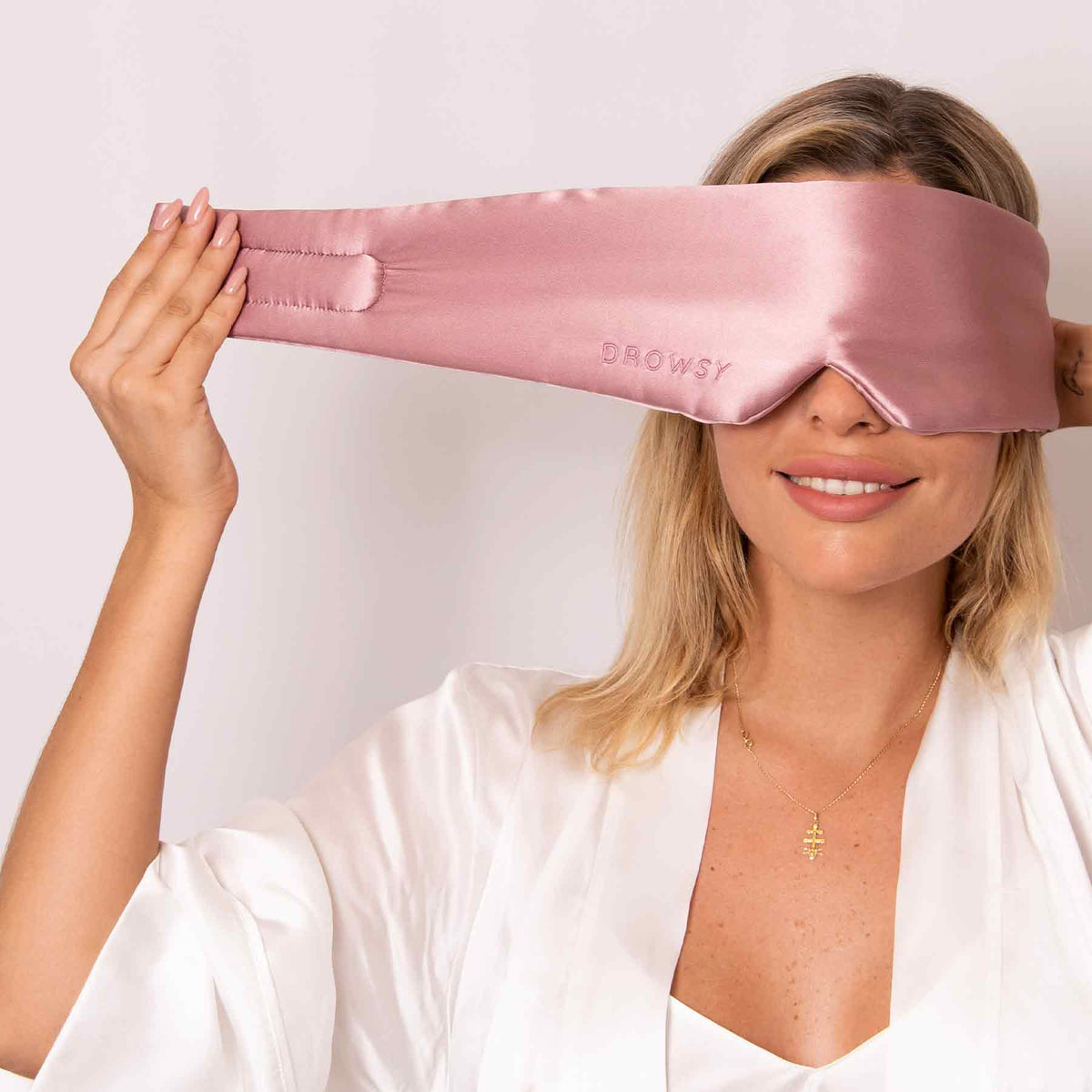 Model demonstrating strapless Drowsy silk sleep mask