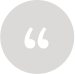 Quotation marks in a grey circle logo.