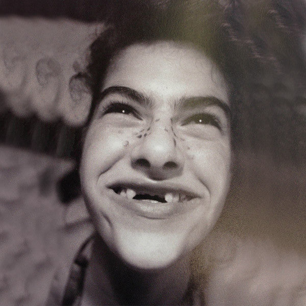 Tracey Emin, Image taken from "My Photo Album", published in 2013. Tracey’s missing teeth are said to be caused by a calcium deficiency, exacerbated by an incident with her brother.