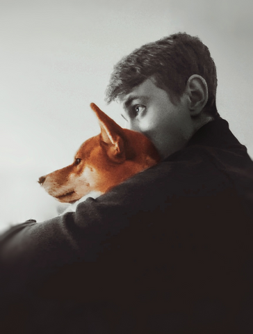 Portrait of Michael Davydov holding his dog