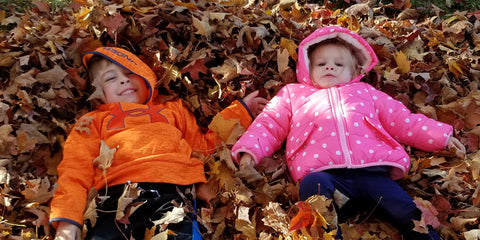 Grandchildren playing in Fall Leaves