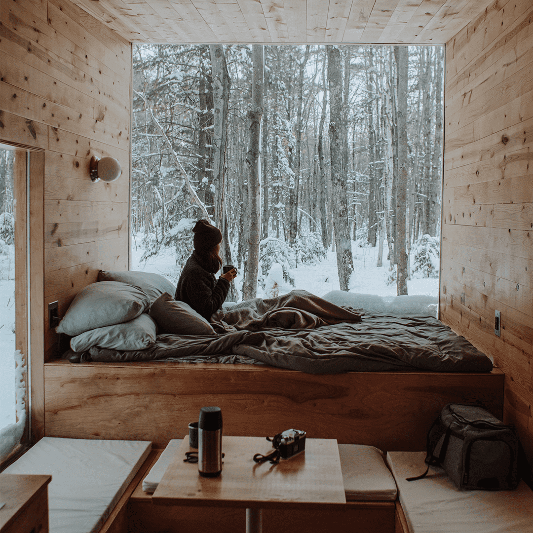 Woman in cosy winter bedroom