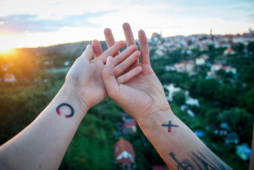 couple with tattoo on hands