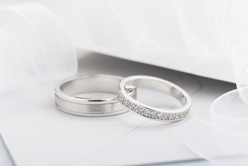 two silver wedding rings