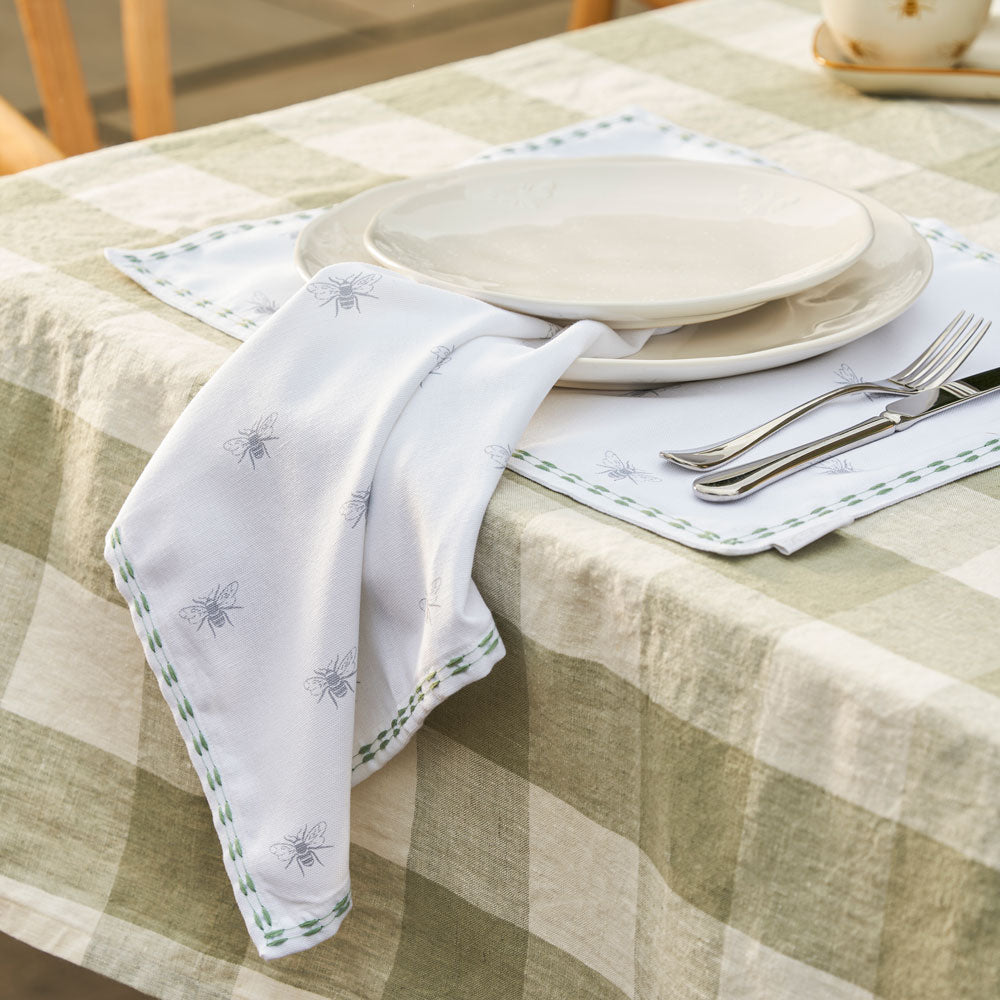 Bees Embroidered Napkins by Sophie Allport on gingham table cloth with silver cutlery and matching fabric placemat