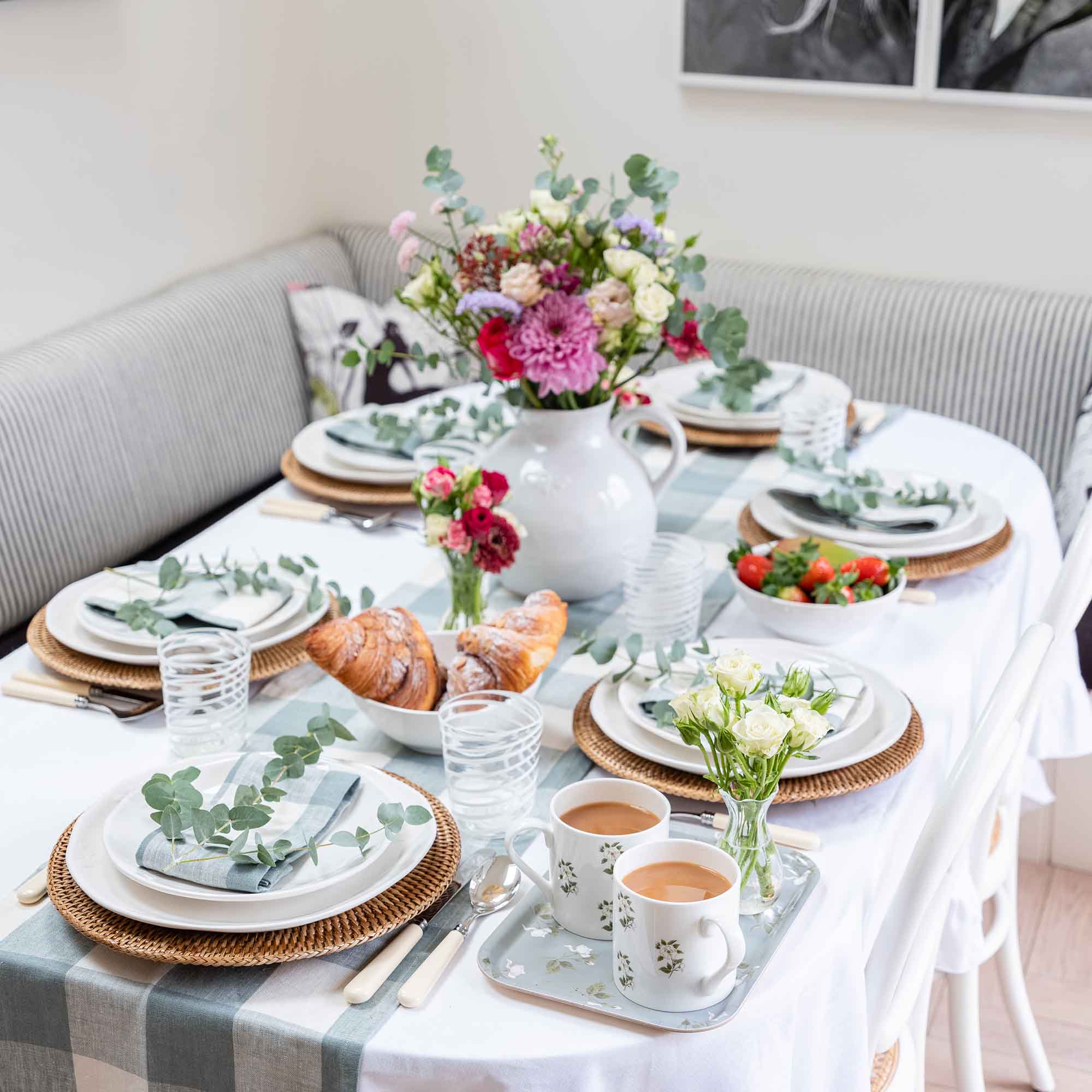 View of the table set for brunch with gingham table linens