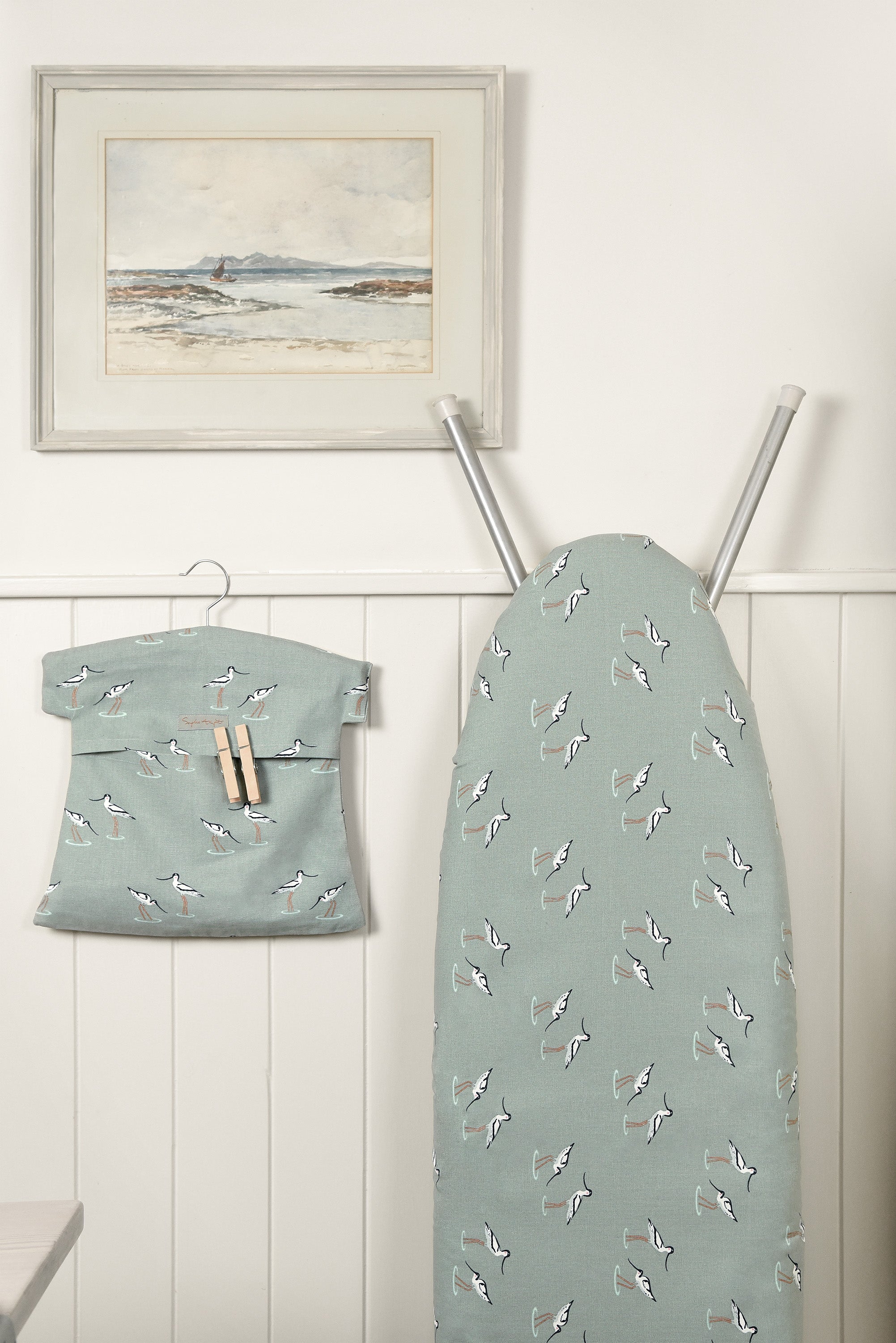 Sophie Allport utility room inspiration in sea blue green coastal birds design, a lovely ironing board cover and peg bag.