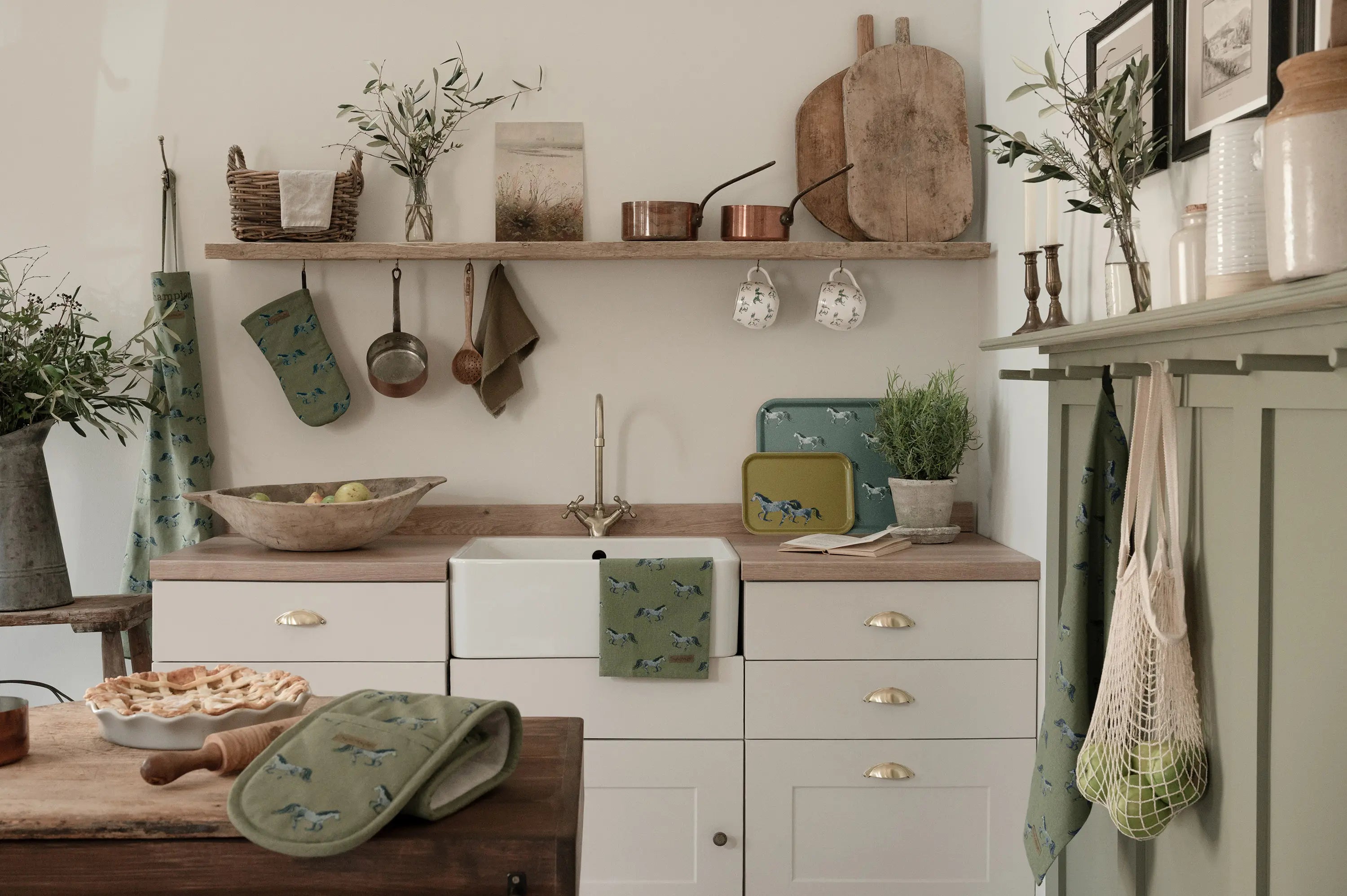 kitchen linens beautifully displayed in a country kitchen featuring galloping horses on a green ground