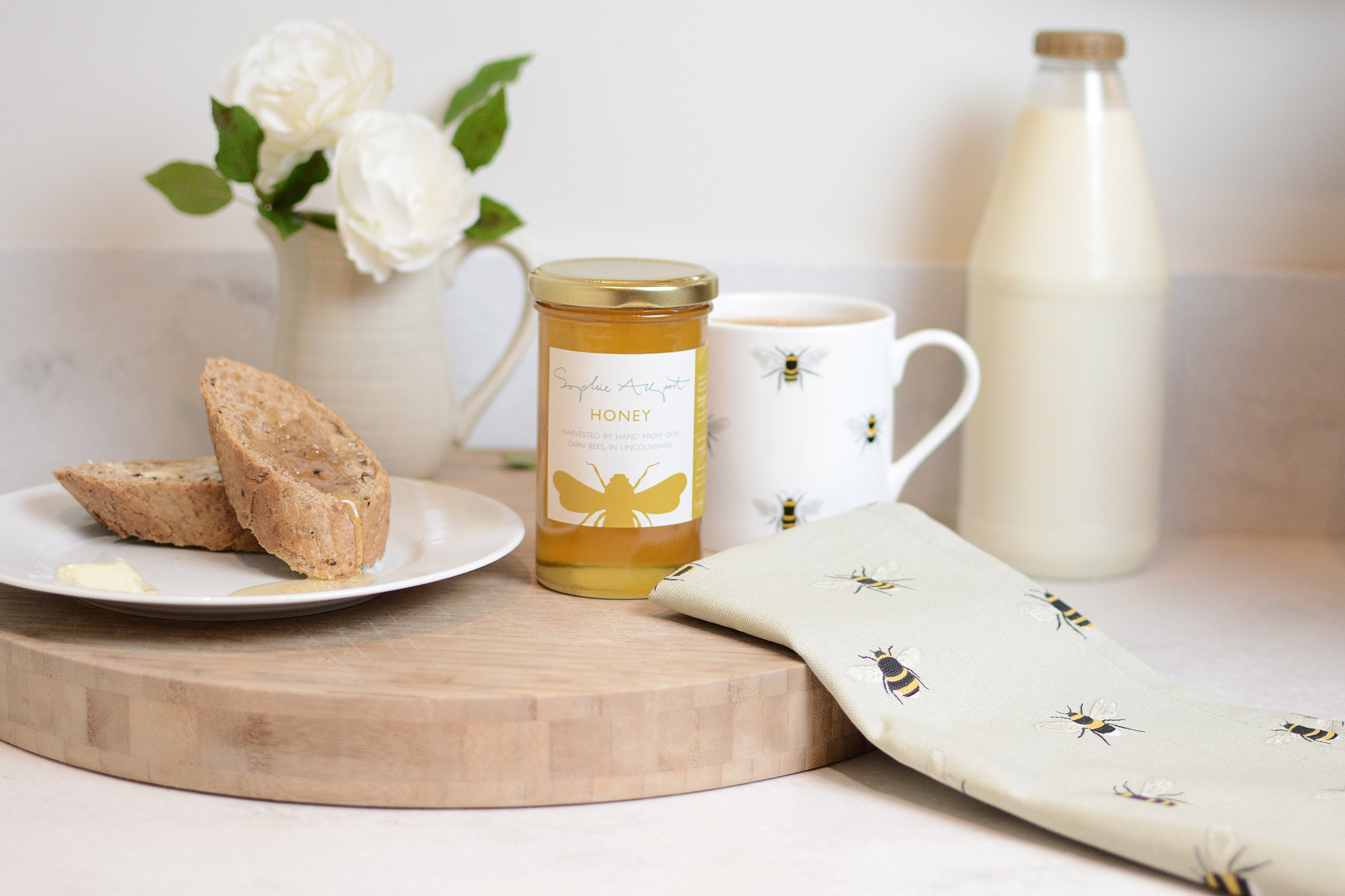 bees tea towel, mug and honey by Sophie Allport