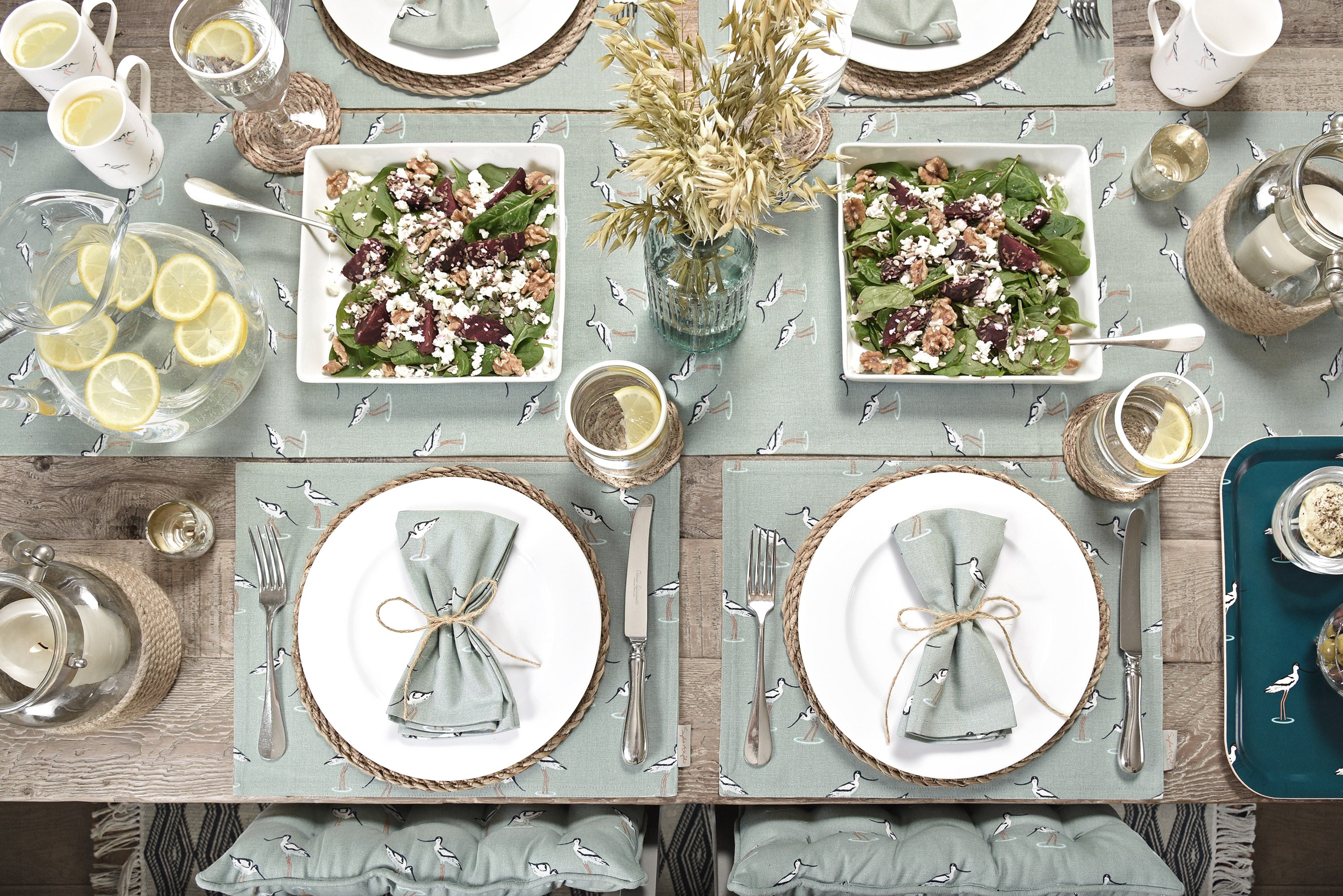 A beautiful table setting, with Sophie Allport's Coastal Birds design, with fabric place mats, napkins and table runner.