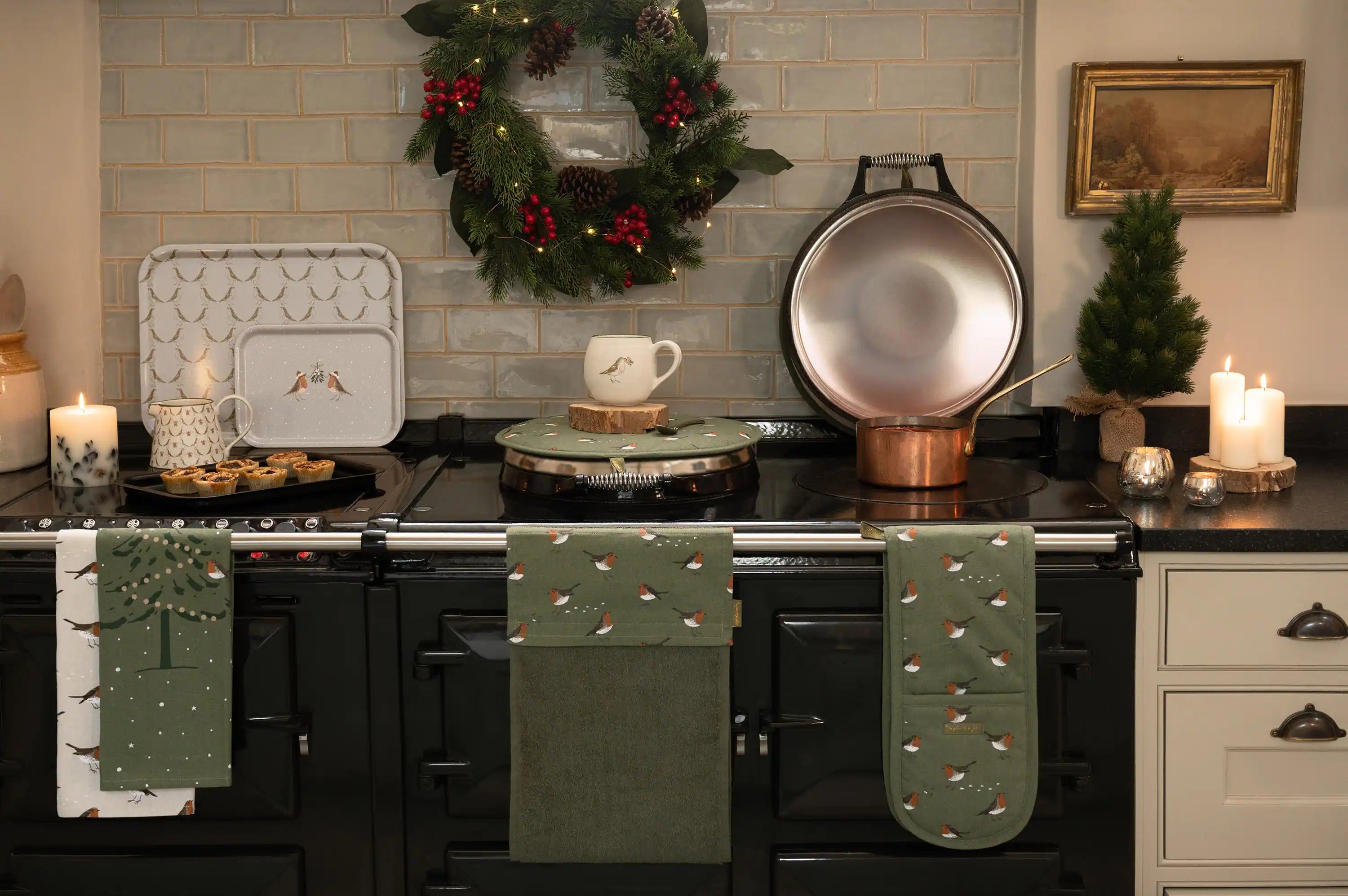 Sophie Allport's Christmas Robins displayed on a country cooking stove