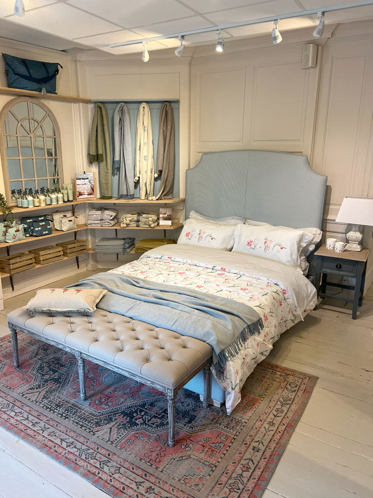 Sophie Allport Stamford Shop featuring a bed with a floral tulip bedding set