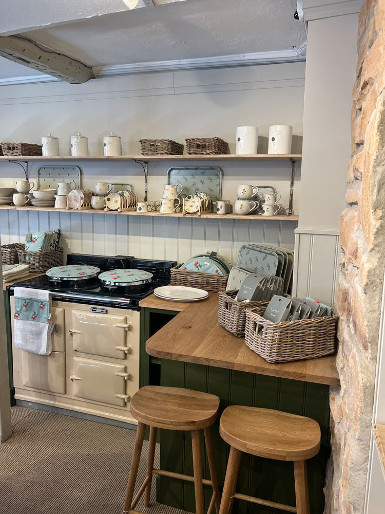 Sophie Allport Stamford Shop featuring aga decorated in kitchen linens that feature Sophie's hand illustrated designs
