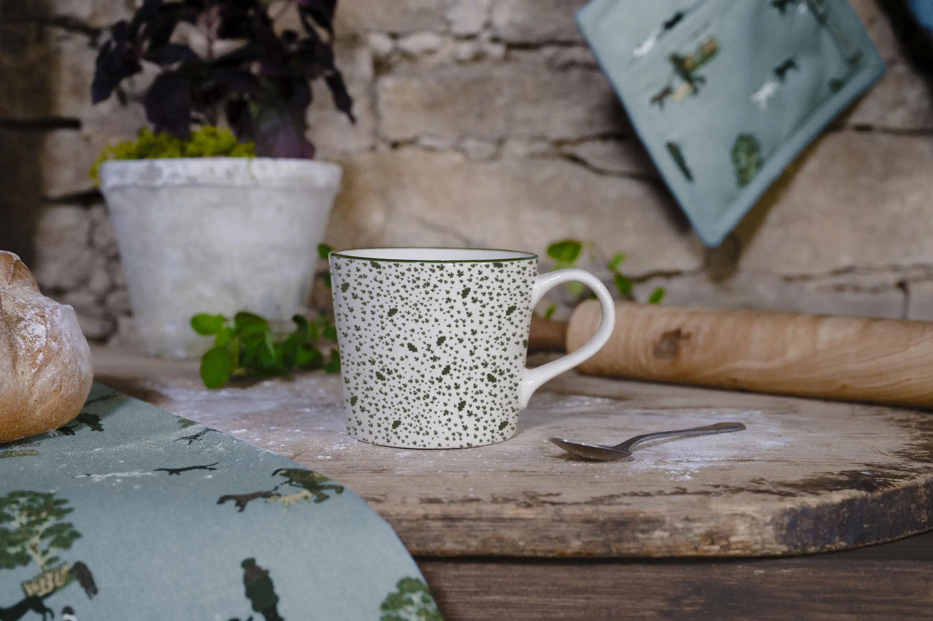 off white stoneware mug featuring green leaf patterns, part of the Sophie Allport X National Trust collaboration