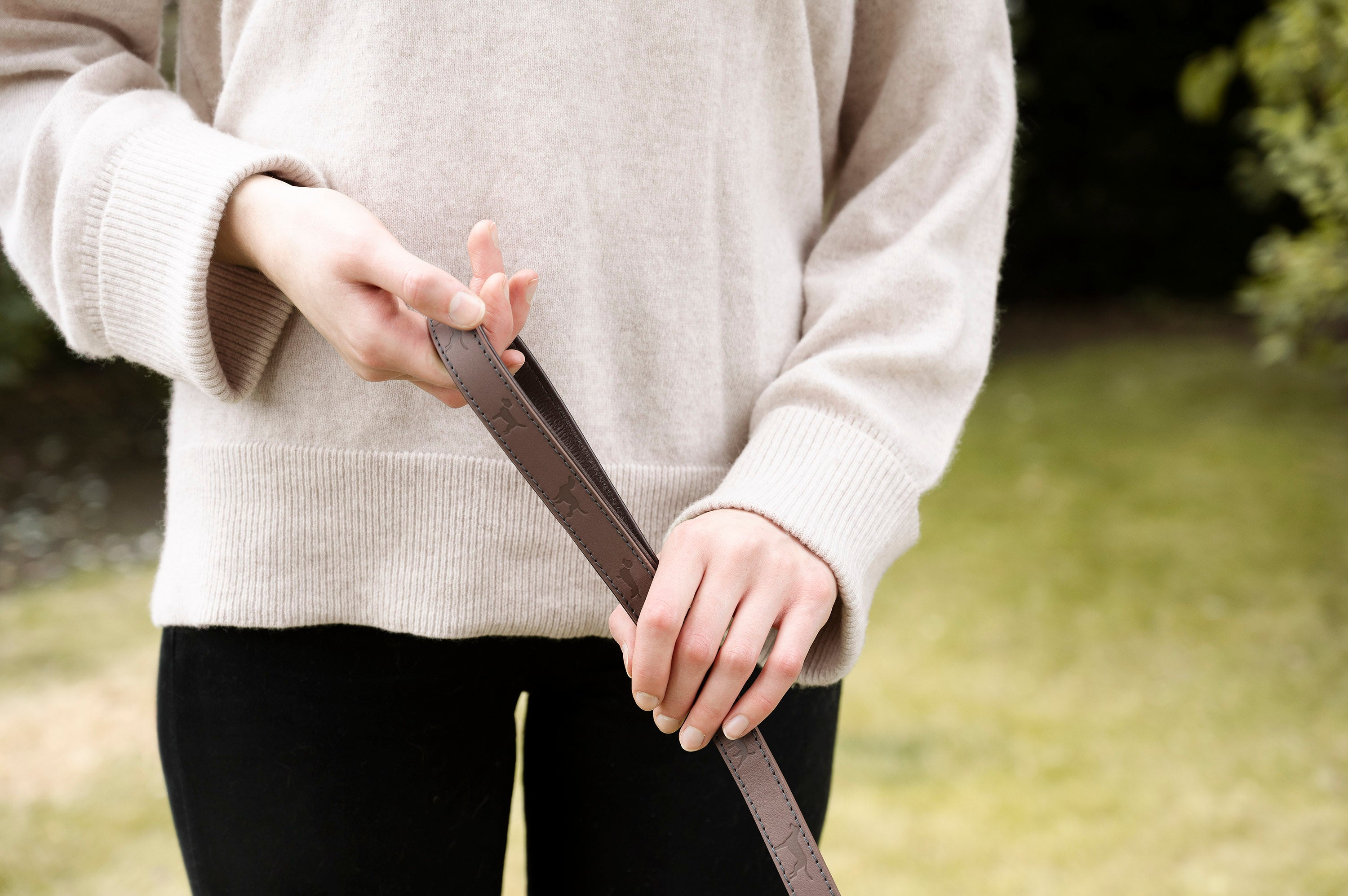 Woman holding dog lead