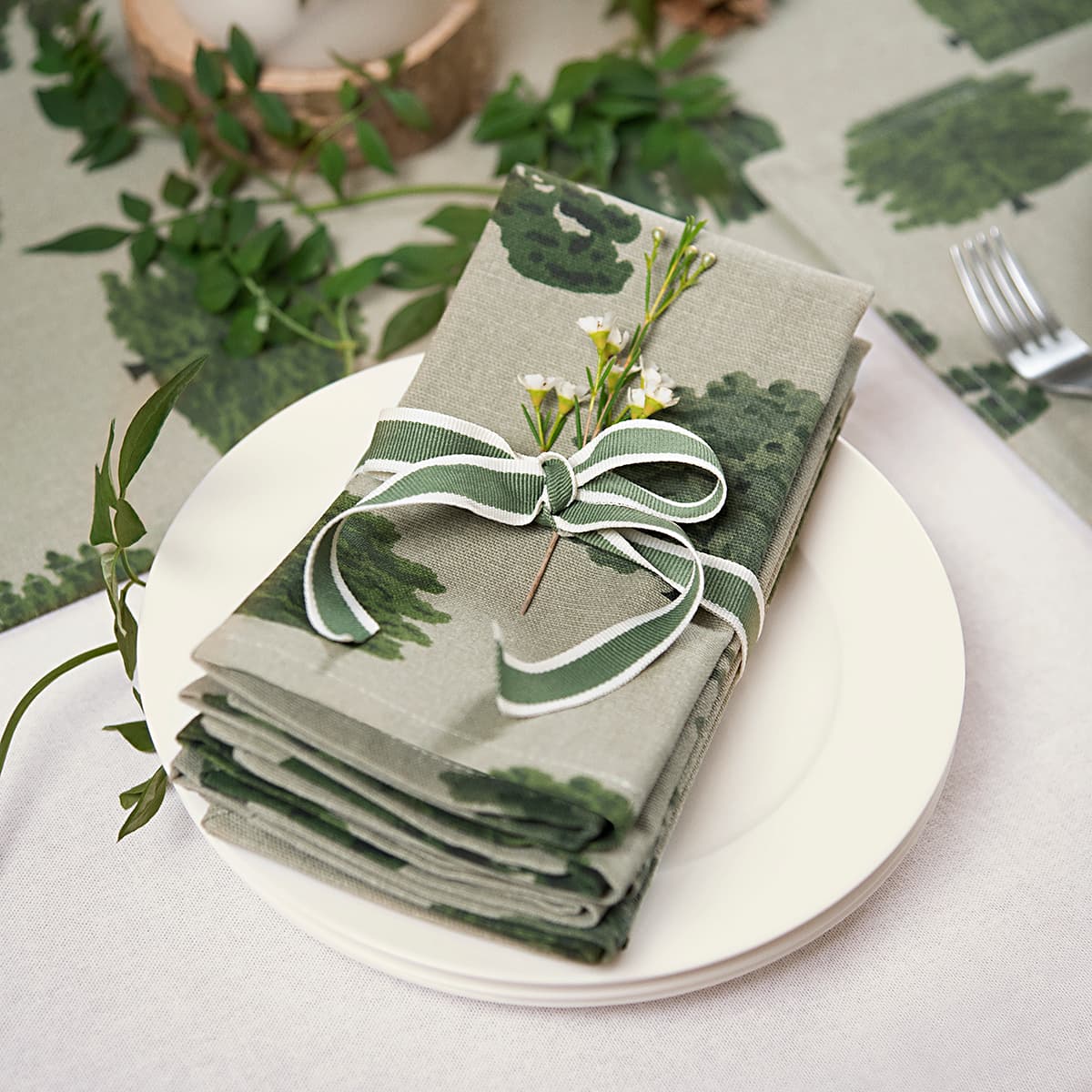 https://cdn.shopify.com/s/files/1/0201/1771/7092/products/all85300-parkland-trees-napkins-set-of-4-lifestyle-high-res-square.jpg?v=1688572966