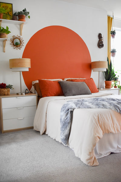 grey blanket draped over foot of bed