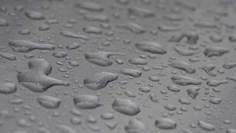 water droplets on a gray surface