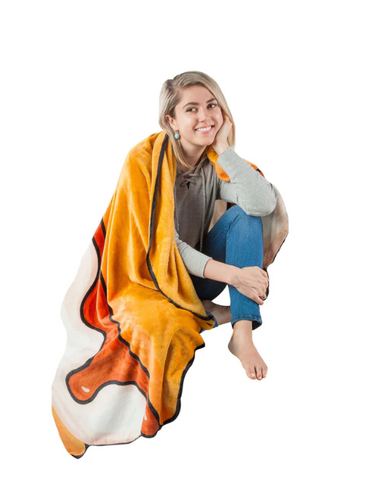Woman wrapped in a BigMouth Inc blanket that looks like a s'more