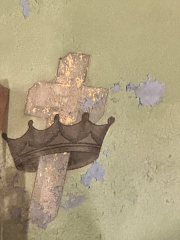 crown and cross of abandoned church