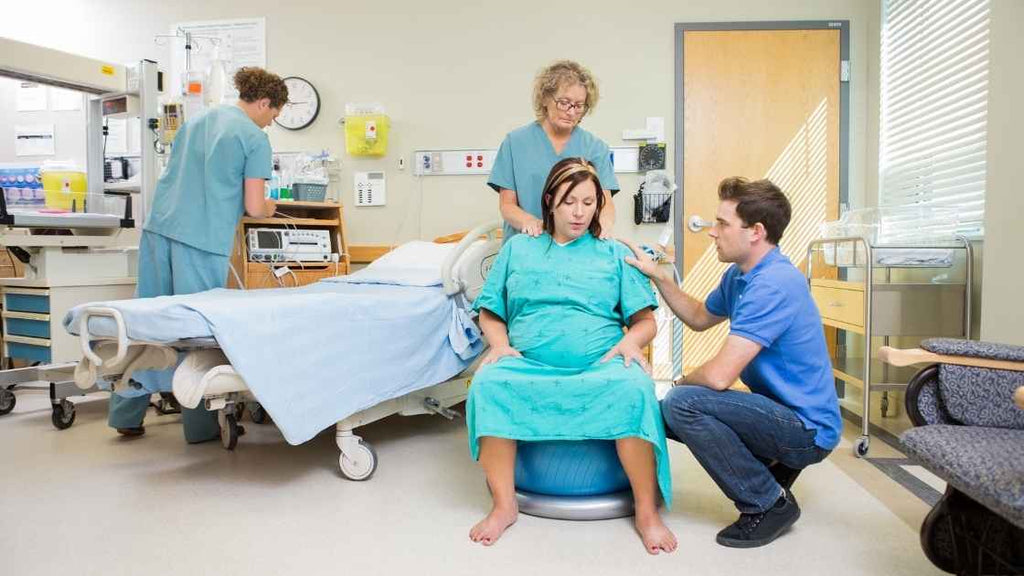 woman on birthing ball in delivery room
