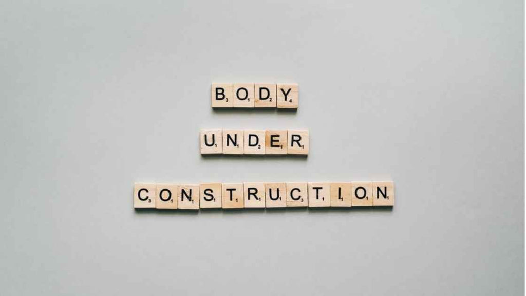 body under construction scrabble blocks