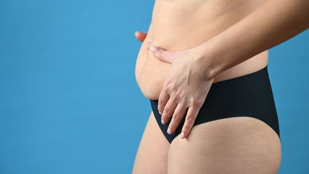 postpartum woman profile of belly