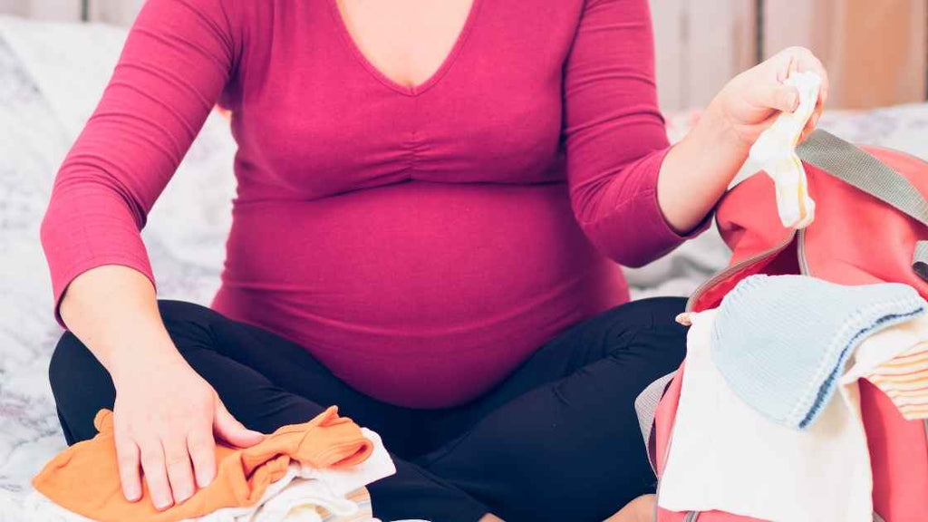 mom packing hospital bag for baby